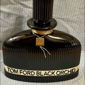 TOM FORD PERFUME BOTTLE. Supersized when compared to the retail version.